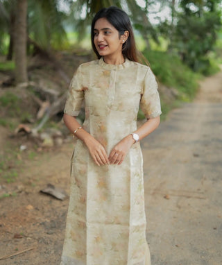 Lightweight golden kurti laid flat