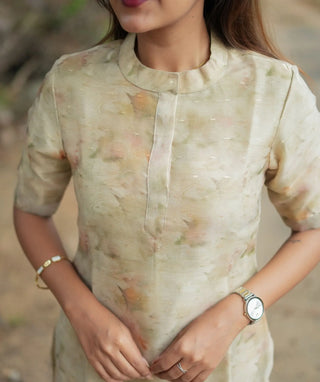 Casual golden silk kurti styled with minimal jewelry