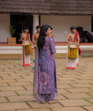 Purple Onam outfit with floral design and soft cotton fabric