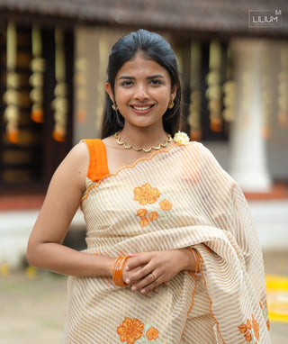 Onam Special Saree with Orange Floral Motifs