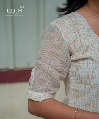 Front button detailing on beige kurti