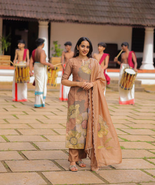 Woman in brown floral kurti set for Onam celebration