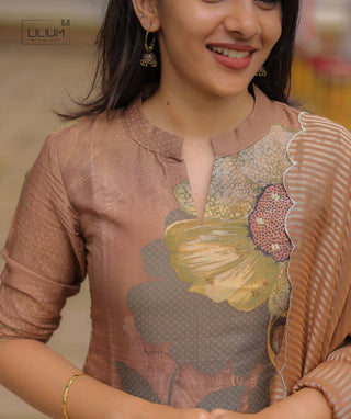 Traditional Onam wear with dupatta and floral design