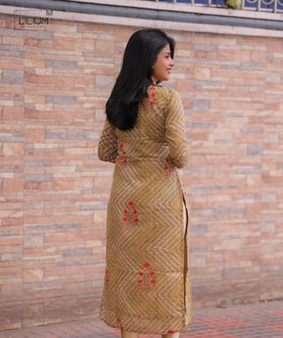 Everyday ethnic kurti in yellow tone – model side pose