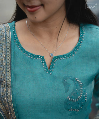 Close-up of pockets on silk dress